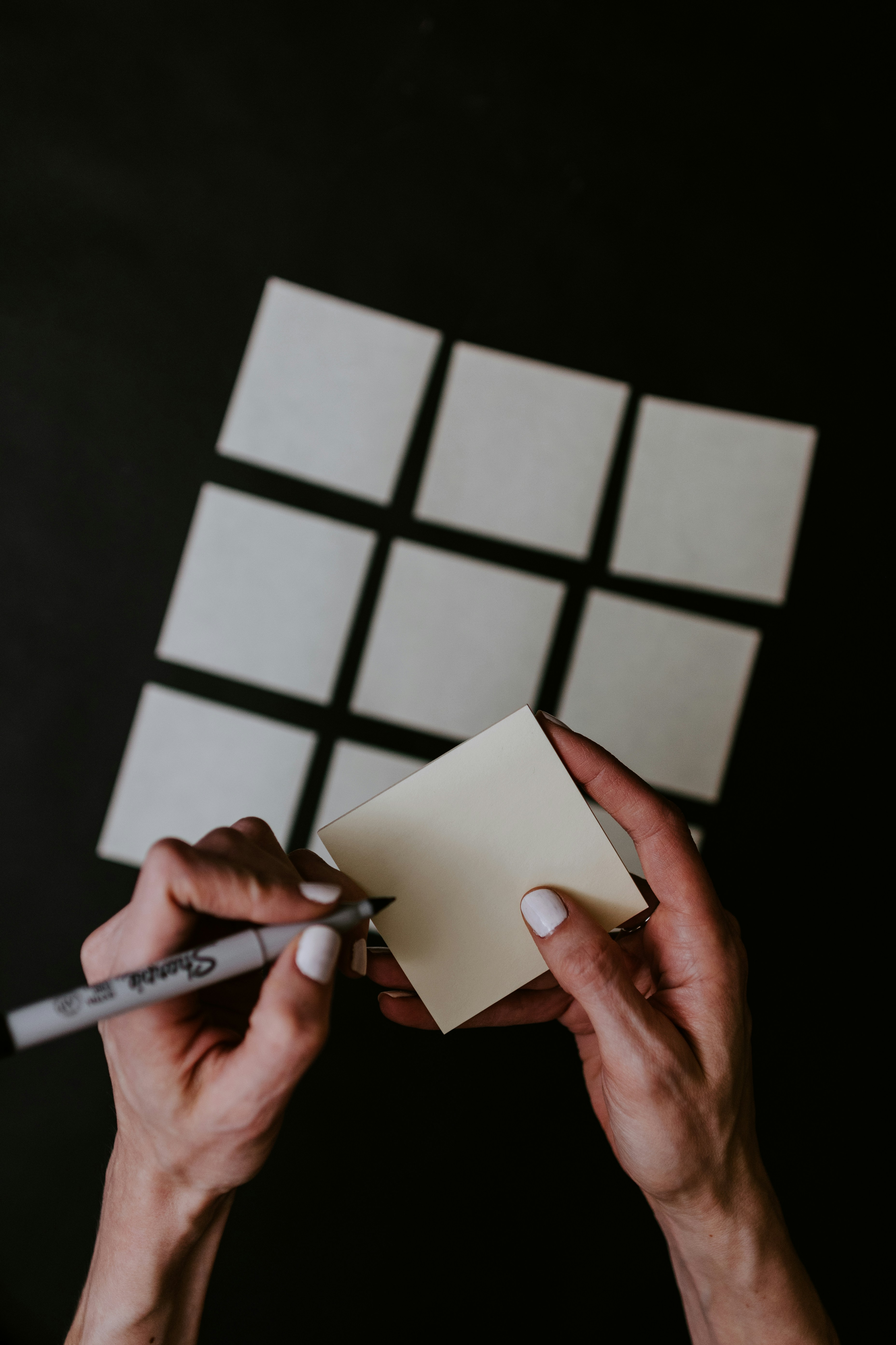Affinity mapping with sticky notes on a grid, sharpie pen