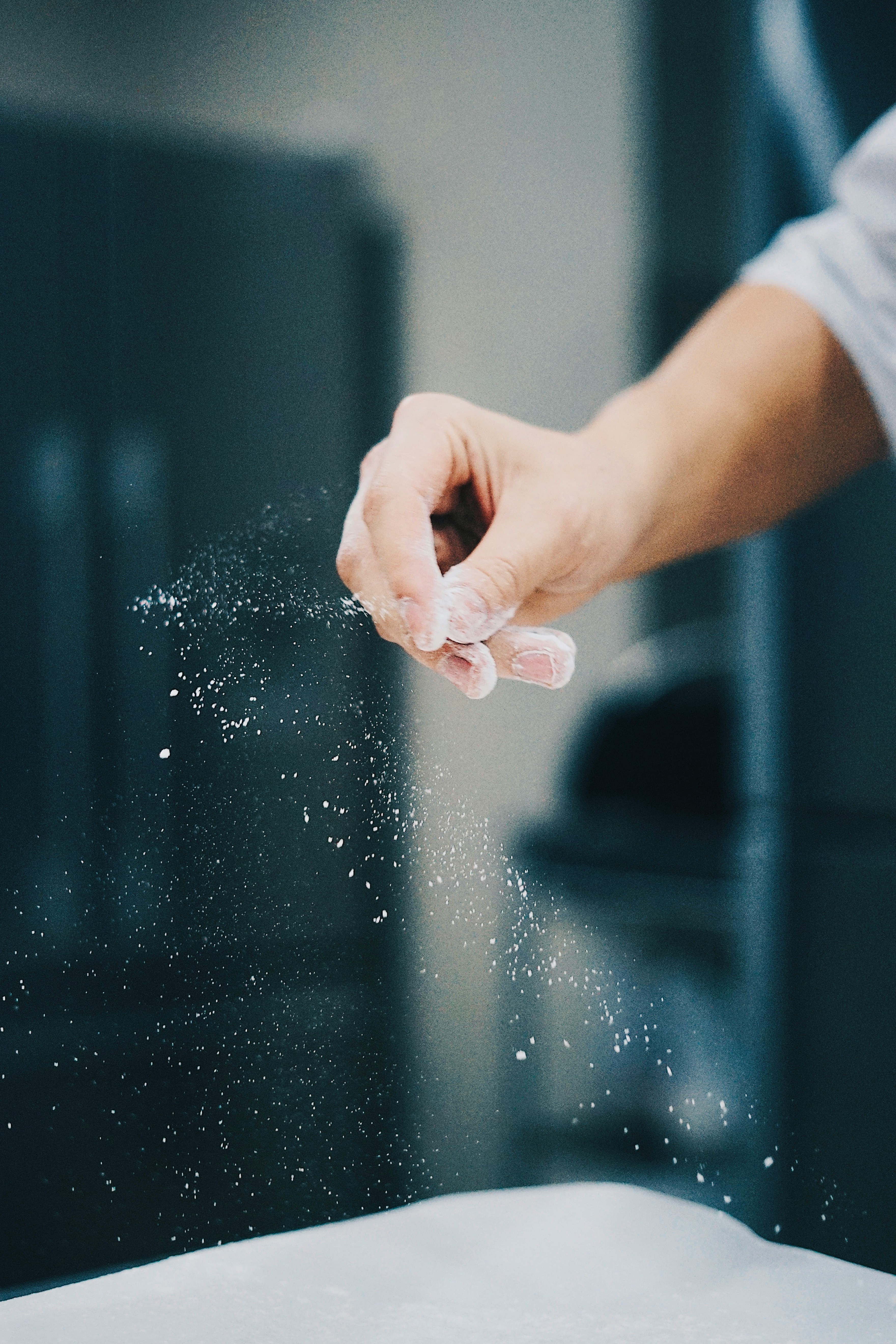Hands working with flour — cooking context