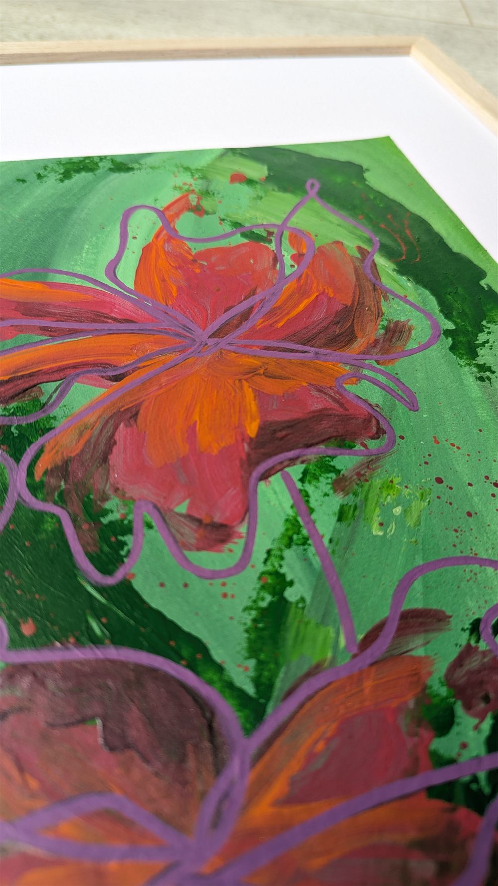 A close-up of On the Forest Floor: a bold semi-abstract painting of a fiery orange and pink flower on a bright green background, finished with a continuous purple line drawing of a flower on top