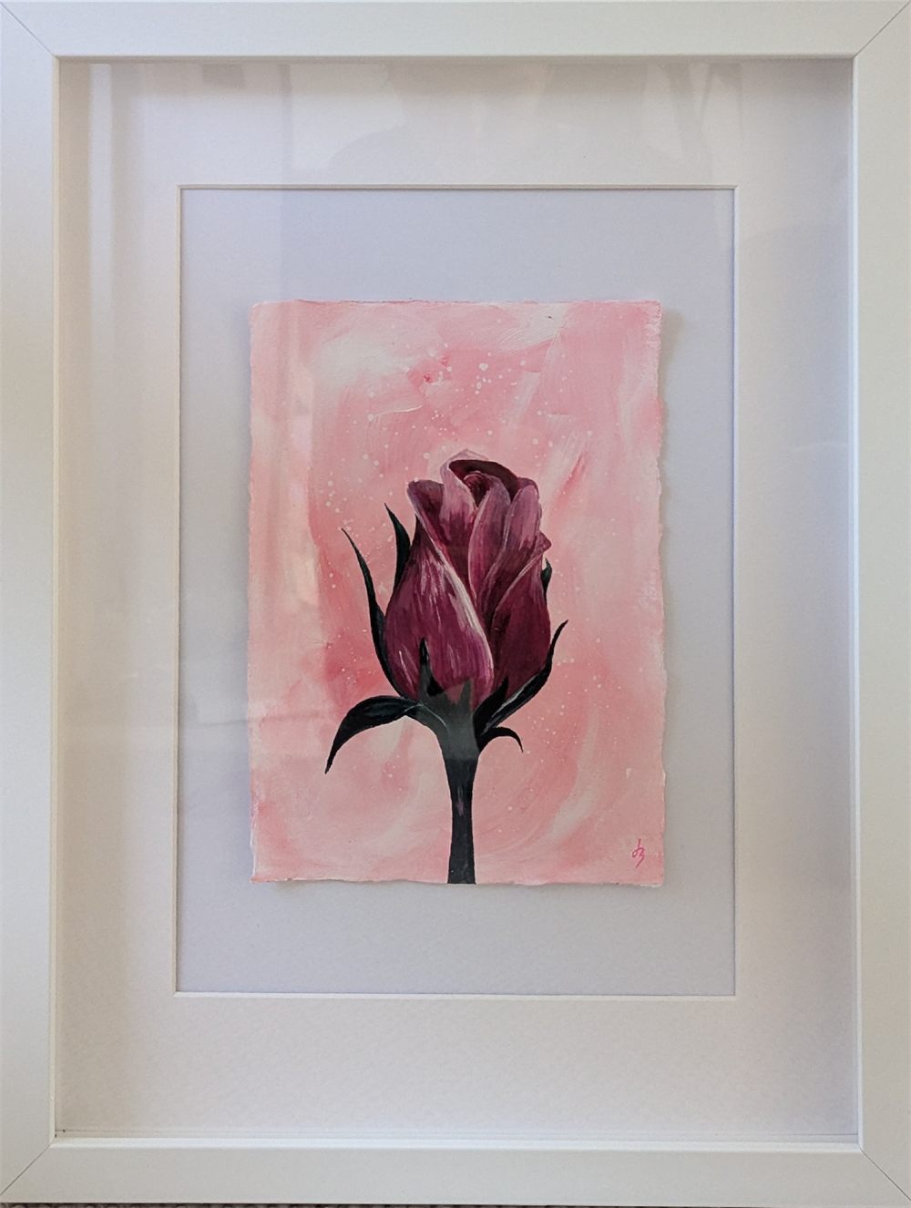 An A5 painting of a delicate rose bud just before it blooms, on deckle-edged cotton paper